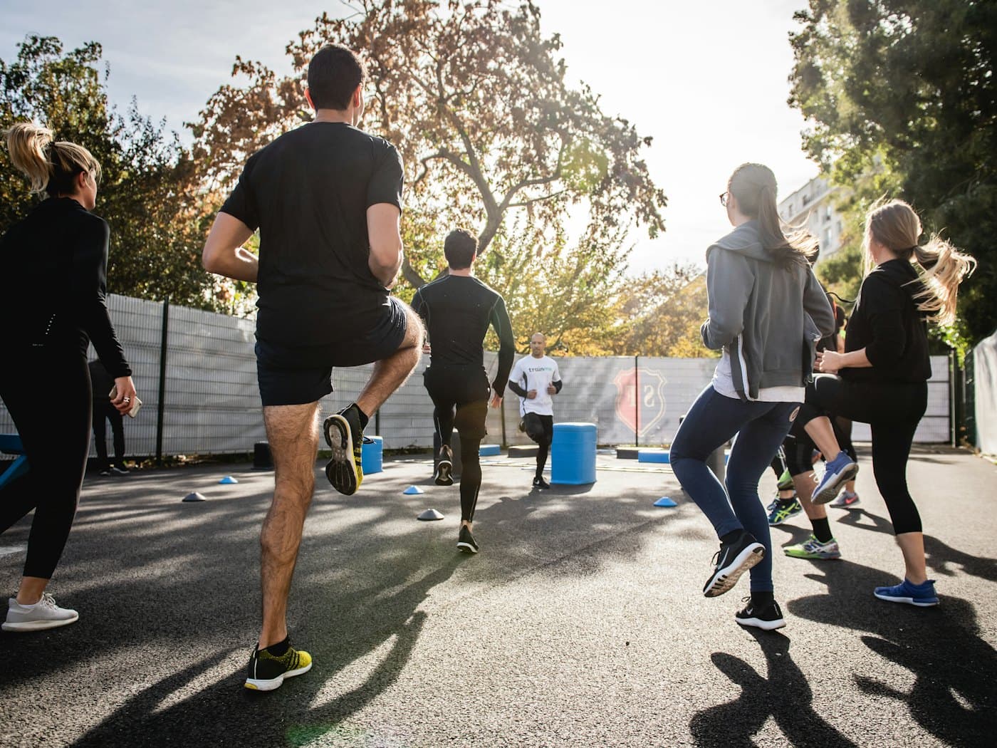 Students training together on an outdoor ground
