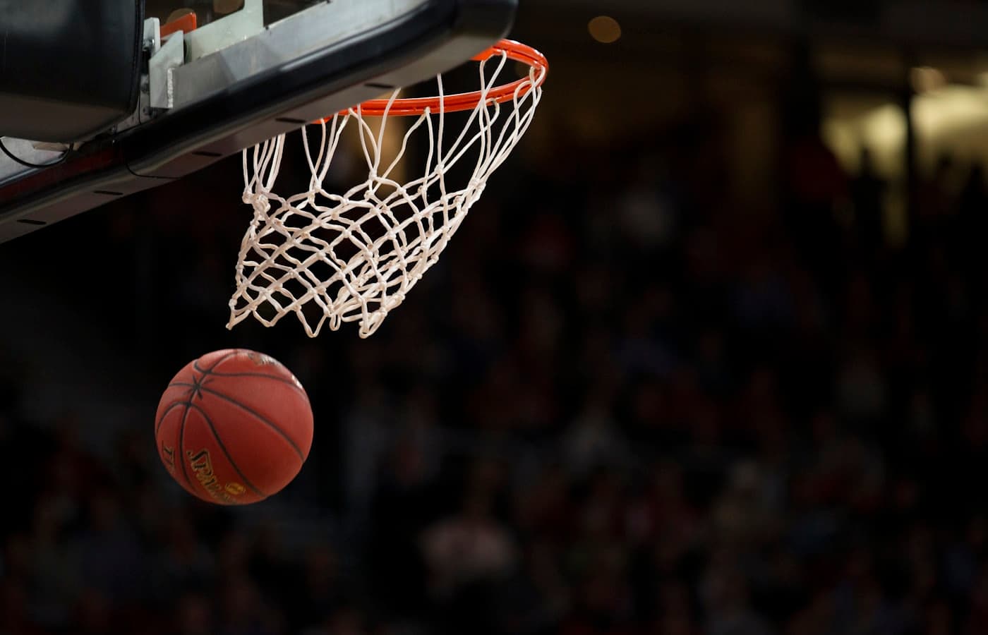 Basketball hoop with a ball passing through