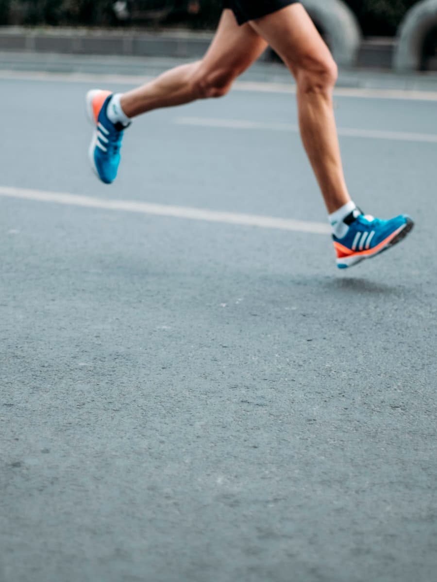 Runner accelerating along a track lane