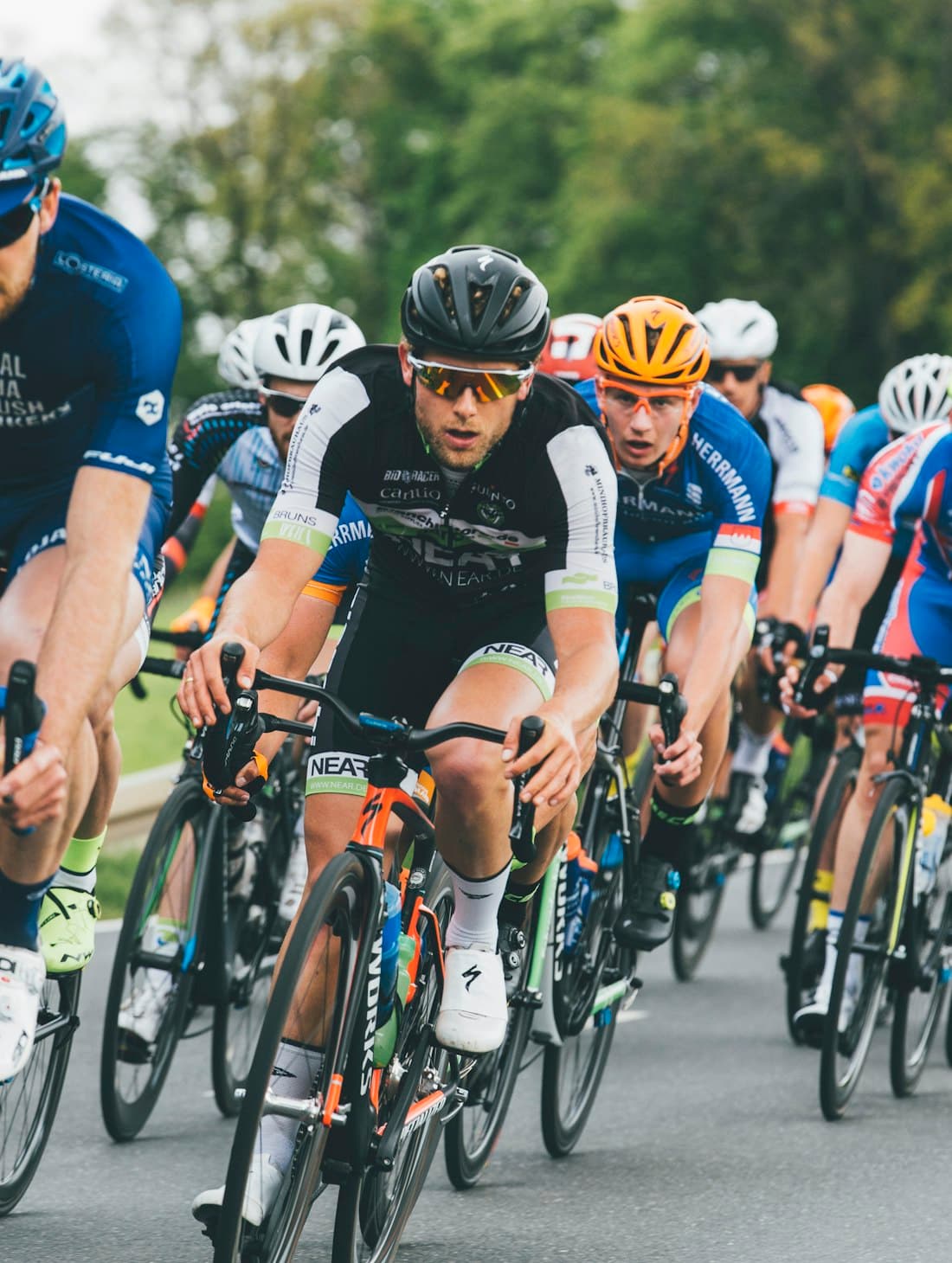 A pack of riders racing in close formation