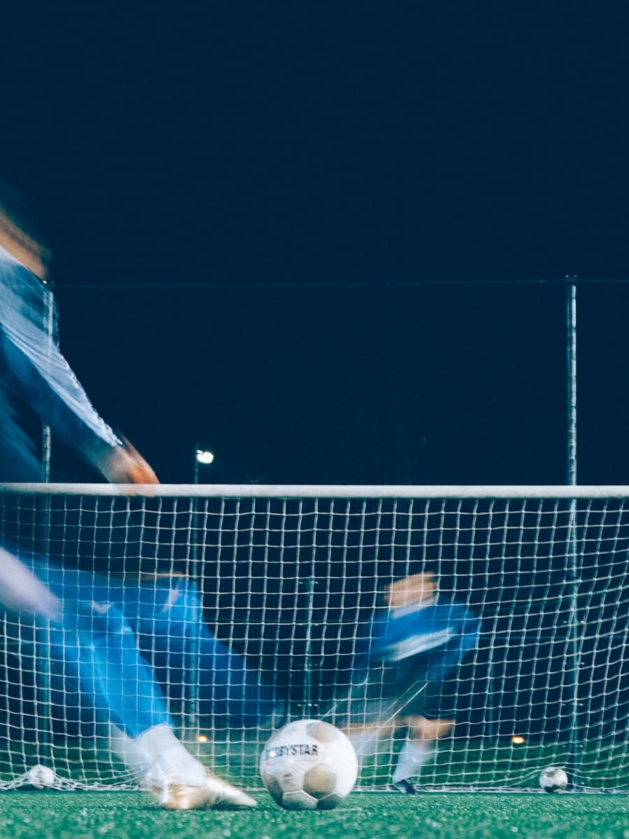 Goalkeeper diving to stop a shot